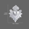 Silver resin heart decoration with flame accents, measuring 15.3cm (6.02inch) high and 12cm (4.72inch) wide.
