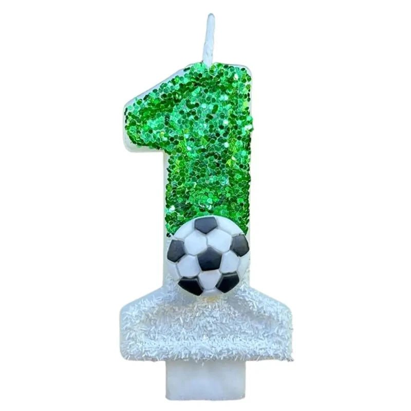 A birthday candle shaped like the number 1, covered in green glitter, resting on a white base.