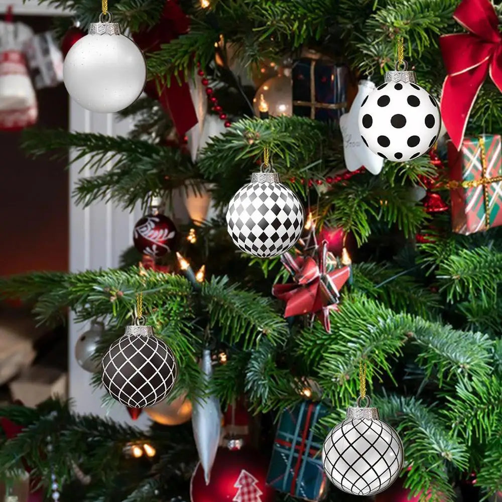 Christmas tree decorated with white and black polka dot ornaments and red ribbon