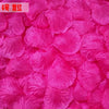 Close-up of vibrant pink silk rose petals used for weddings and events.