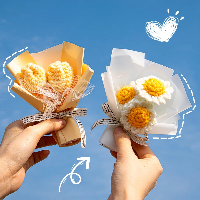 A pair of hands holds a bouquet of handmade crochet flowers in light yellow and white paper for a special occasion.