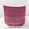 A stack of solid magenta disposable paper food trays for parties and events.
