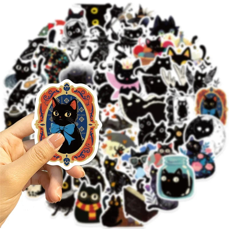 A hand holds a pack of cartoon black star cat PVC stickers for DIY crafts and scrapbooking.