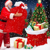 A man dressed as Santa Claus is holding a large red gift bag in a snowy setting with a decorated Christmas tree and wrapped p
