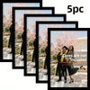 A set of five black wooden picture frames displaying a woman in a graduation gown and mortarboard against a backdrop of pink 