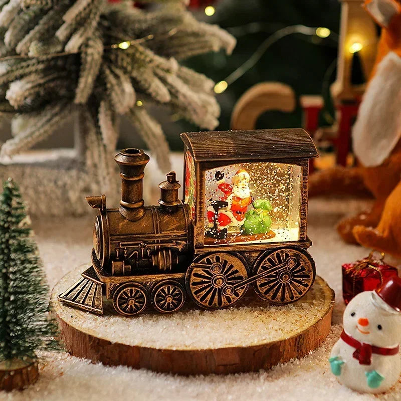 A wooden Christmas train music box with LED lights and a water-filled crystal ball resting on a wooden slice.