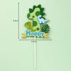 A green dinosaur shaped number one cutout with a happy banner on a stick.