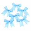 A set of light blue satin ribbon bows for gifts and DIY crafts