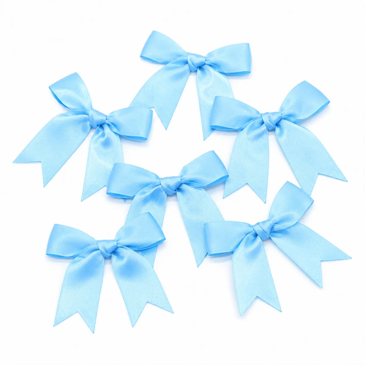 A set of light blue satin ribbon bows for gifts and DIY crafts