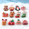 Assorted Christmas resin cabochons including bears, reindeer, houses, and festive decorations set in snow.