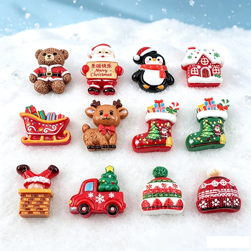 Assorted Christmas resin cabochons including bears, reindeer, houses, and festive decorations set in snow.