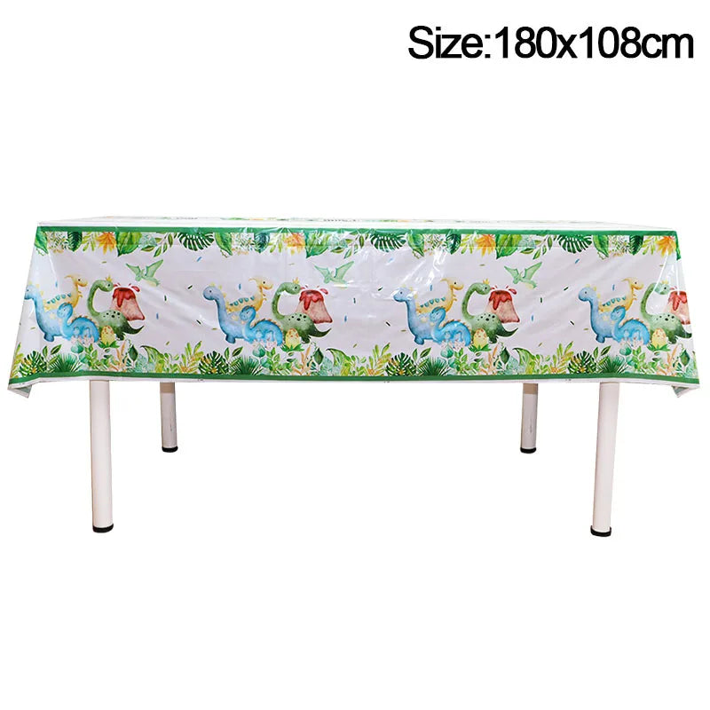 Green and white dinosaur themed disposable table cover with a banner and balloons