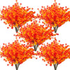 A bouquet of vibrant orange and red artificial daisy-like flowers used for autumn home decor.