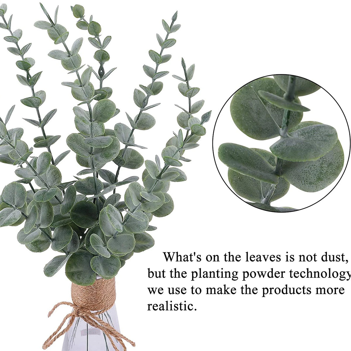 A bundle of artificial eucalyptus leaves in various shades of green displayed in a glass vase.