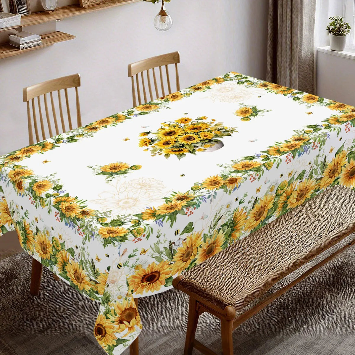 Sunflower printed tablecloth with floral pattern set on a wooden dining table.