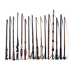 A collection of black and brown metal-resin magic wands standing upright against a white background.