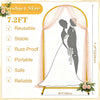A large gold metal arch backdrop stand displaying a silhouette of a couple in a wedding dress.