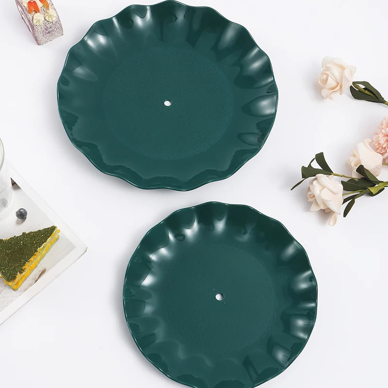 A dark teal two-tier serving stand for desserts and fruit, featuring a glossy finish.