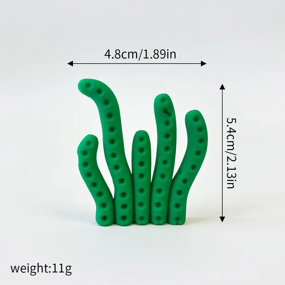 A set of three green ocean animal cake toppers: a whale, an octopus, and a turtle.