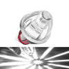 A close-up view of a clear LED side marker light assembly with red wiring visible, showing its beam pattern.