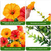 Artificial hanging morning glory flowers in orange and red with green eucalyptus leaves