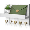 Rustic wooden wall-mounted organizer featuring a green envelope and five brass hooks.