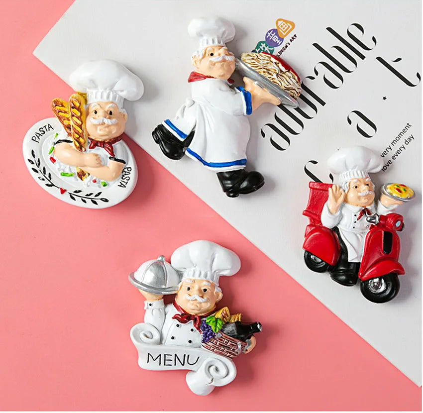 A set of cute 3D fruit fridge magnets featuring chefs and food items on a pink background.
