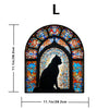 A stained glass window featuring a silhouette of a black cat in an arched design.