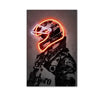A canvas wall art featuring a motorcycle helmet with neon orange accents against a dark background.