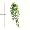 A long, cascading arrangement of artificial green leaves used for home decor.