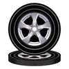 A set of black and silver racing wheels for a birthday party decoration.