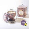 A gift set featuring a candle in a glass holder and a box, with a lemon illustration nearby.
