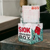 A red and green box labeled SIOK SMASH BOX with a grid of dollar amounts sits on a dark surface.