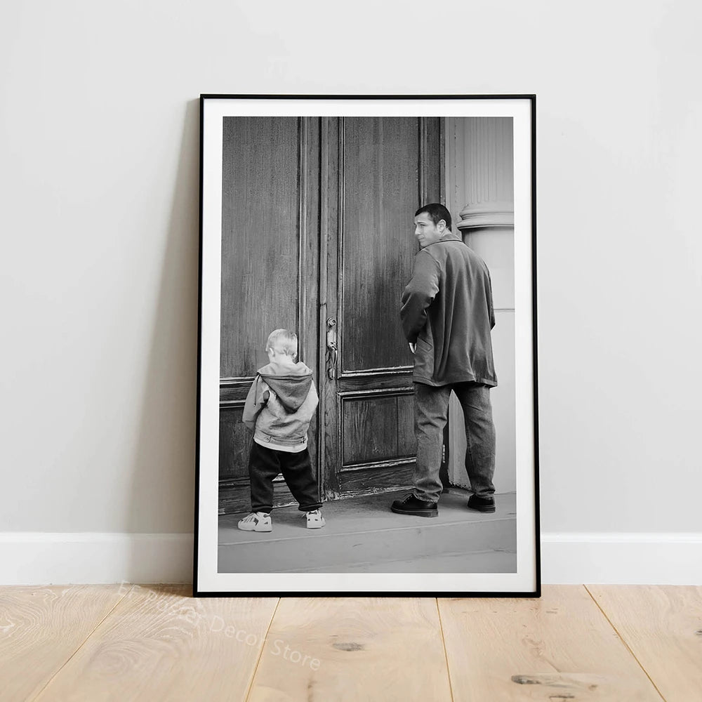 Black and white photograph of a man standing in front of a wooden door.
