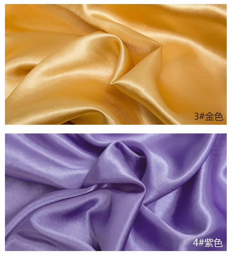 Two swatches of satin fabric in gold and purple colors showing the drape and sheen.
