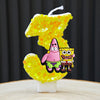 A set of SpongeBob birthday cake candles shaped like the number 1, featuring characters like Patrick and Squidward.