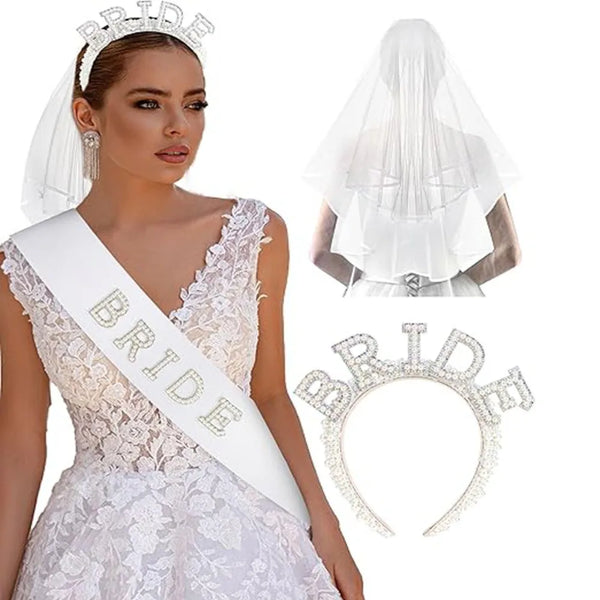 A bride wearing a white lace wedding dress, a bridal sash, and a sheer veil and headband.