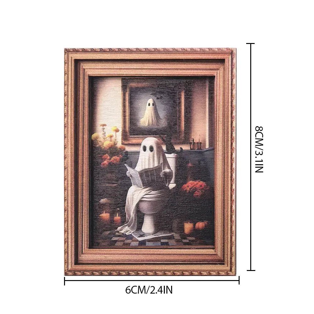 A framed painting featuring a white ghost figure and pumpkins, displayed in a wooden frame.