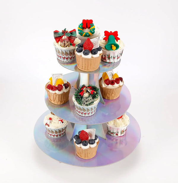 A three-tier rainbow cupcake stand displaying various decorated cupcakes with colorful frosting and toppings.