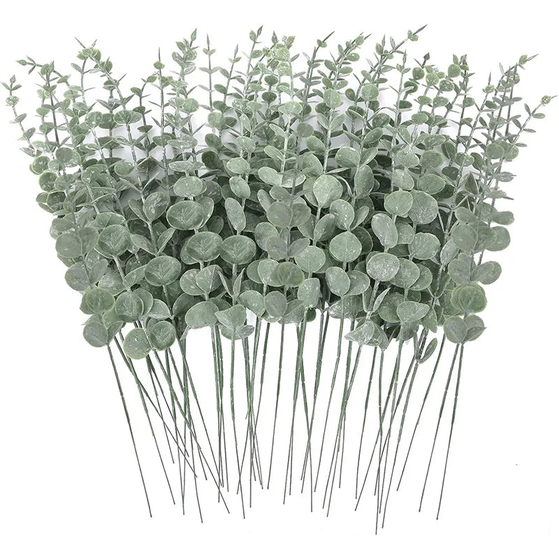 A bunch of artificial eucalyptus leaves with long stems used for home decor or events.