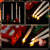A set of six white flameless taper candles with a remote and timer displayed on a red surface.