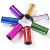 A collection of colorful glitter curling ribbon rolls in various shades including purple, gold, blue, silver, and green.