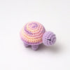 Handmade crocheted turtle plush with purple and pink stripes