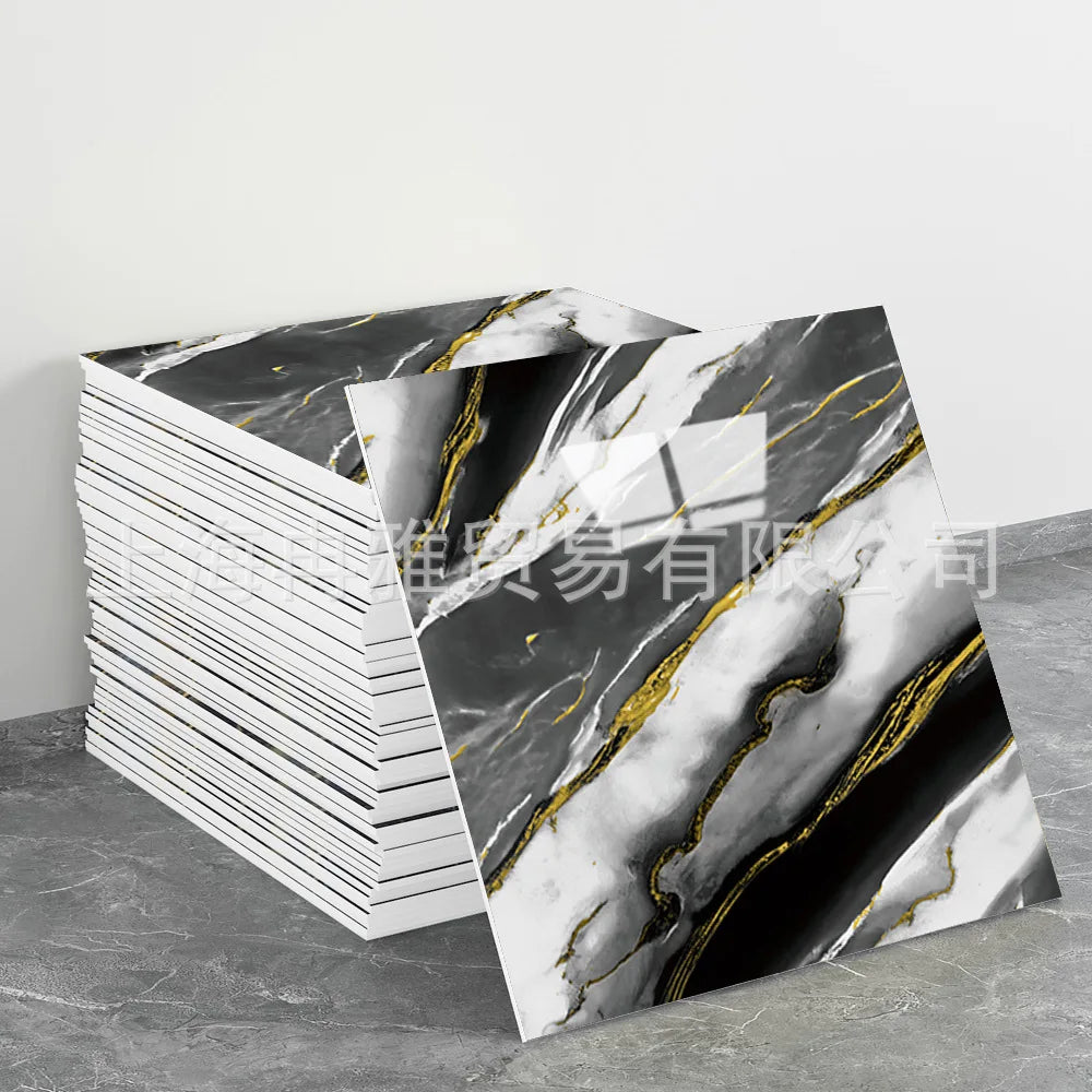 Stack of faux marble 3D self-adhesive wall tiles featuring black and white marble patterns with gold veining