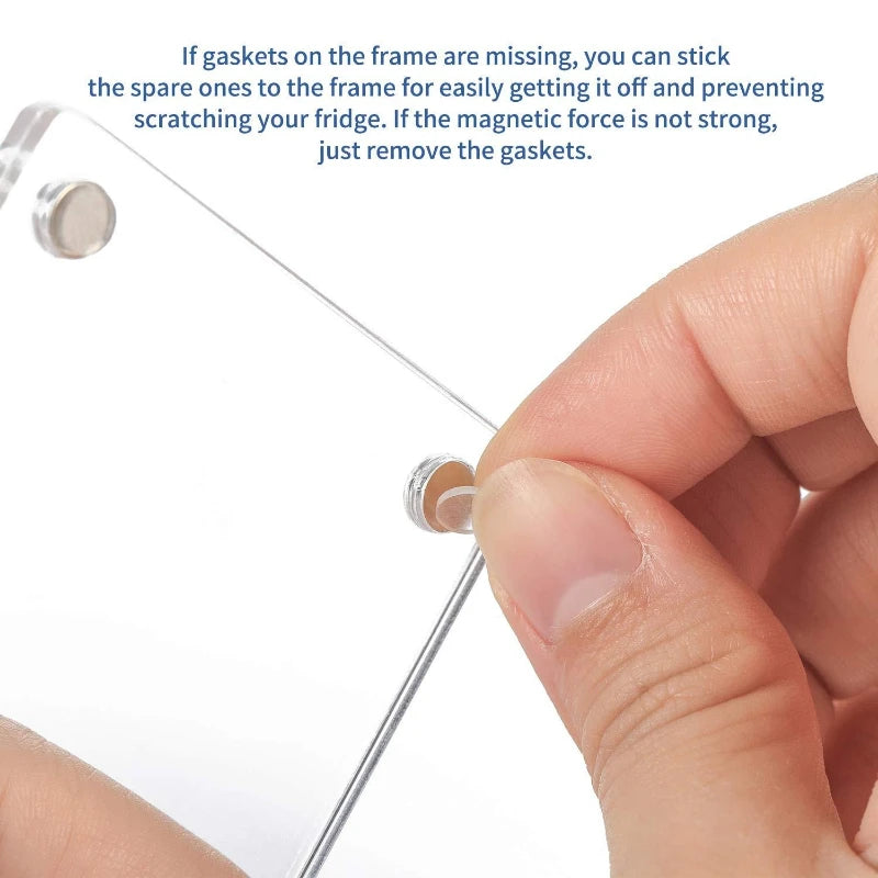 A hand is shown attaching a clear acrylic photo frame magnet to a glass surface, illustrating how to remove or secure the gas