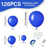 A collection of royal blue balloons and accessories including latex balloons, a ring, and a small metal piece.