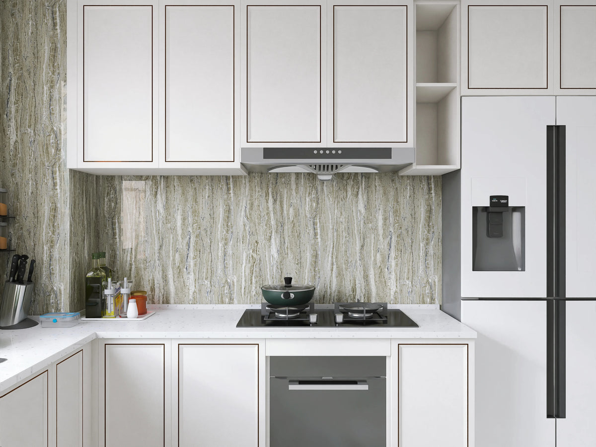 Modern kitchen cabinetry featuring light gray marble pattern backsplash and white cabinets.