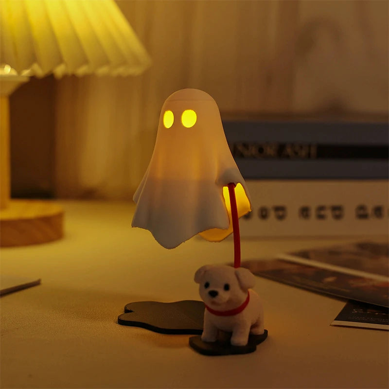 A white ghost light fixture illuminates a small figurine of a dog sitting on a desk.