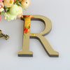 A gold letter R cutout is shown next to a bouquet of light yellow and pink flowers.