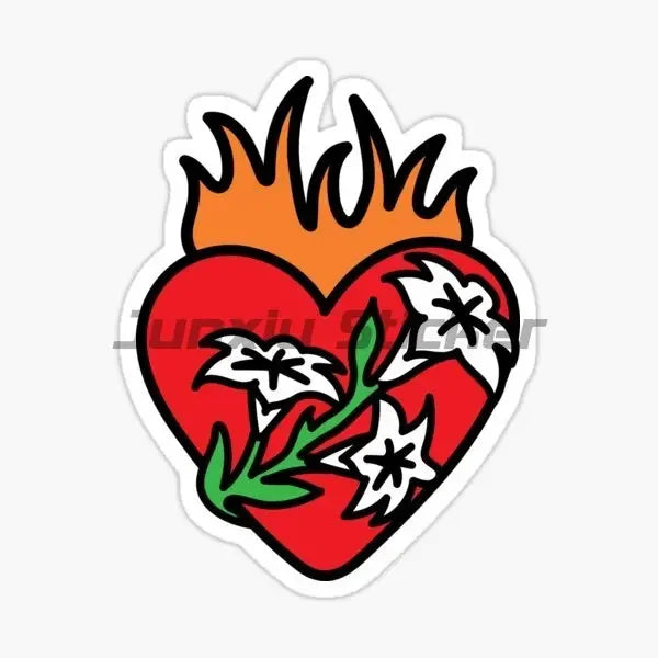 A red heart shape with a yellow flame on top, decorated with white floral elements.